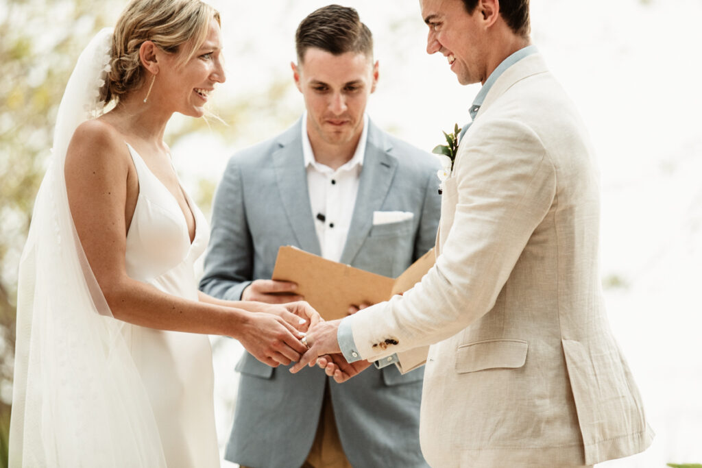 bride and groom exchanging rings