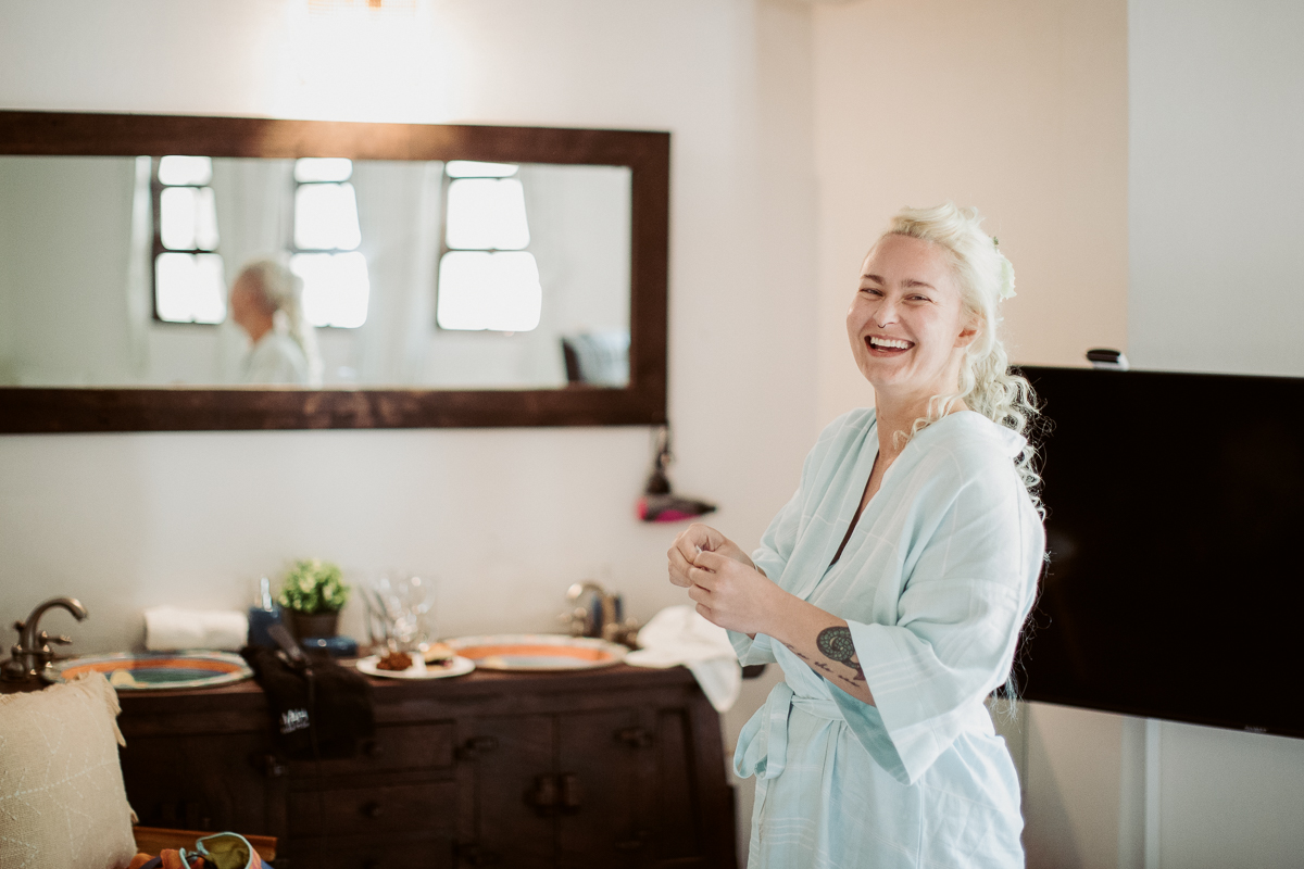 Bride laughing with friends